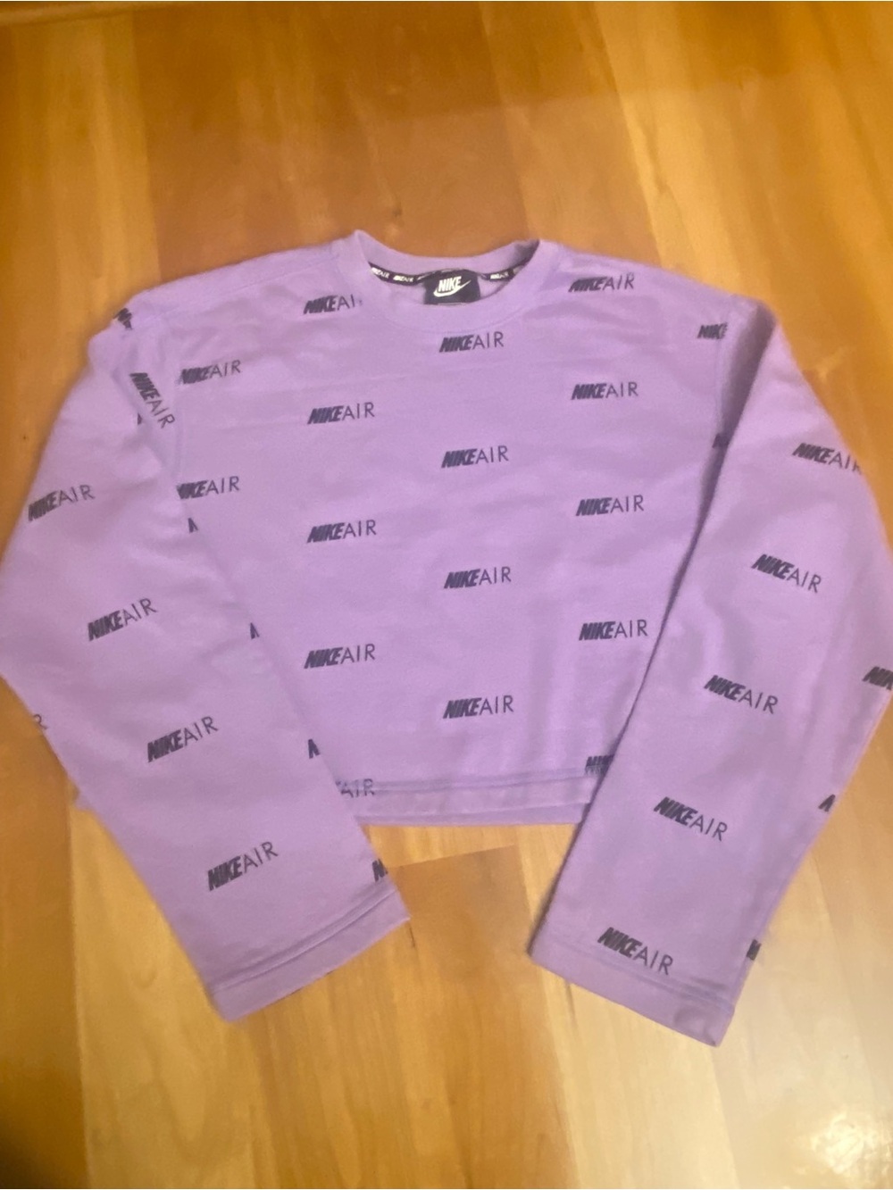 Nike Air Lilac Cropped All-Over Logo Print Fleece Crewneck
Sweatshirt